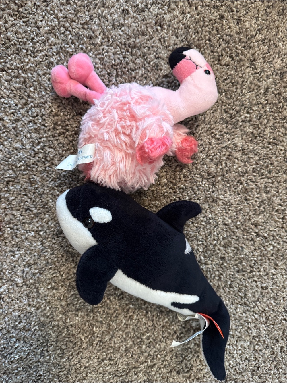 Flamingo and whale stuffed animals